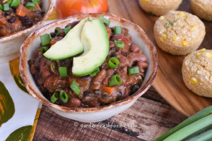 Bowl of Butternut Squash Veggie Chili With Vegan Corn Muffins