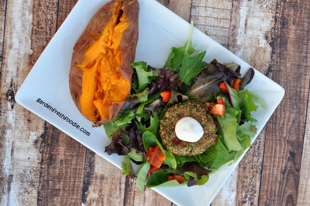 Cauliflower Veggie Burger With Salad and Topped With Cashew Cream
