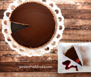 Chocolate Ganache Torte Slice With Pureed Blueberry Sauce