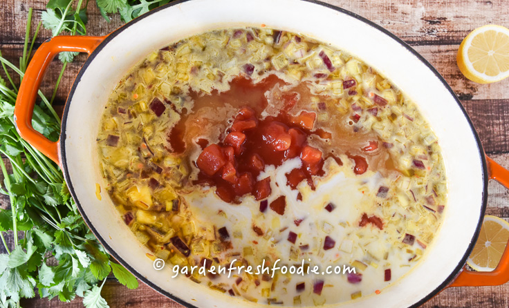 Adding in Tomatoes and Coconut Milk Red Lentil Daal
